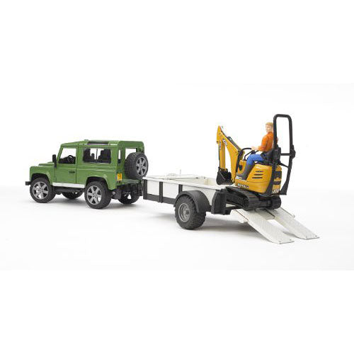 Land Rover Defender with trailer, JCB excavator and man